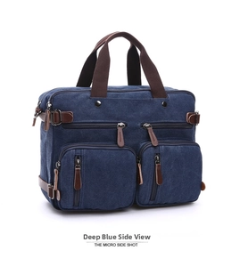 Detail view of deep blue canvas multi-function bag with brown handles and front zip pockets