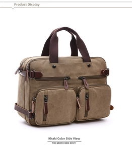 Detail view of khaki canvas business bag with dual zip pockets and leather handles
