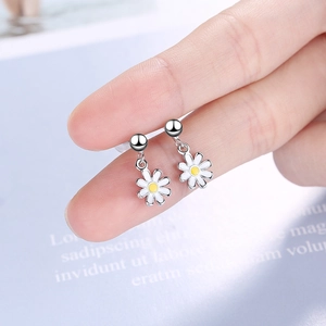 Delicate daisy dangle earrings in silver-tone with white petals and yellow centers