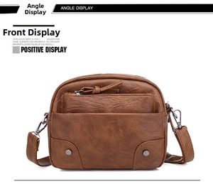 Vue de face du sac bandoulière en cuir marron avec double fermeture éclair et rivets
