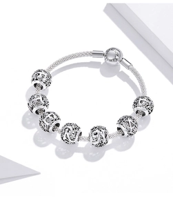 Detail of S925 sterling silver mesh bracelet featuring 'Forever Family' engraved clasp