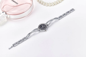 Detail of silver quartz watch with black dial and 925 certified metal link strap