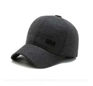 Detailed close-up of thick dark grey wool baseball cap with SPORT side patch for men