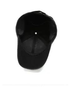 Macro detail of men's winter baseball cap showing the thick inner lining and stitching