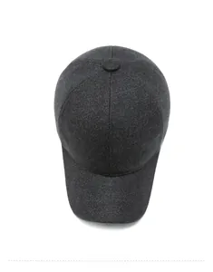 Top view of dark grey winter baseball cap showing textured wool fabric and sport patch
