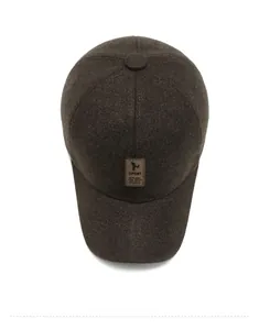 Top view detail of dark coffee winter baseball cap fabric texture and sport patch