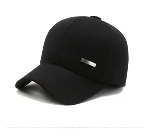 Detail of winter baseball cap with ear protection and silver metal SPORT badge decoration