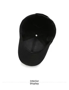 Detail view of the black baseball cap's inner lining and reinforced six-panel stitching