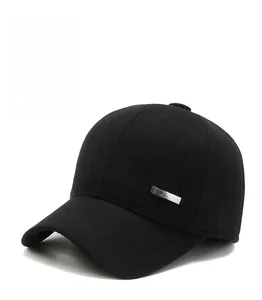 Close-up of black wool-like baseball cap with ear protection and SPORT metal side badge