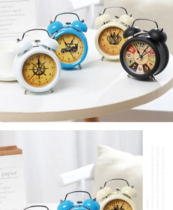 Detailed macro view of vintage metal double bell alarm clock with classic dial patterns