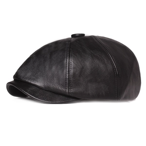 Detail view of the black PU leather newsboy hat showing the crown button and short brim