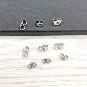 Macro view of stainless steel butterfly earring backs for DIY jewelry making