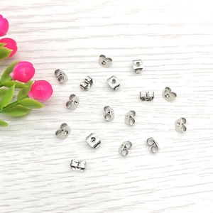 Close-up of silver butterfly clutch earring backs for DIY jewelry making accessories