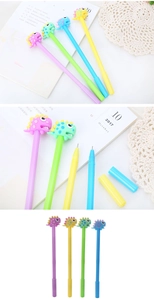Close-up of cute cartoon dinosaur gel pens in purple, green, blue, and yellow colors