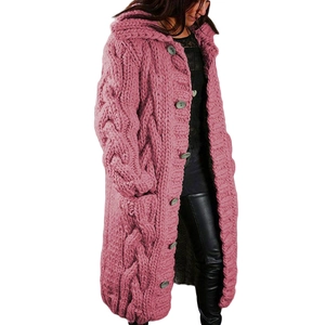 Close-up of pink cable knit texture on a long button-up cardigan coat for women