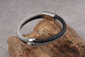 Detail of double-layer woven leather bracelet with silver metal mesh and magnetic clasp