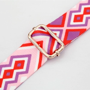 Adjustable geometric patterned shoulder strap with durable gold metal buckle