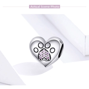 Close-up of S925 sterling silver heart charm with pink zircon paw print pattern