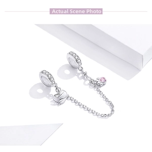 Macro shot of S925 silver safety chain with pink cat paw and white zircon accents