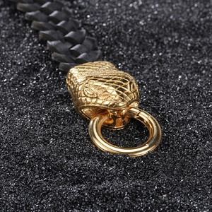 Men's leather bracelet with gold double snake heads and braided steel cord