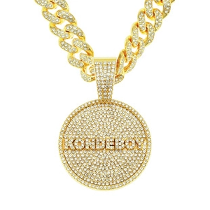 Close-up of gold-plated iced out Cuban link necklace with KONDEBOY lettered pendant