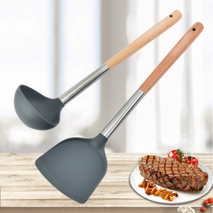 Detail of grey silicone spatula and soup spoon set with ergonomic wooden handles