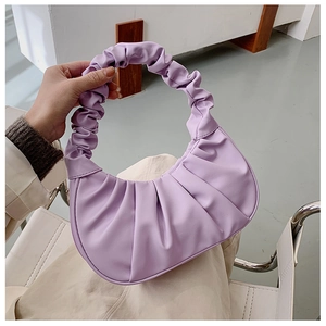 Close-up of lavender pleated handbag detail with premium matte faux leather texture