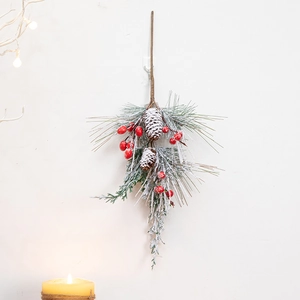 Christmas wall hanging with red berries, snowy pine cones and needles for festive decor