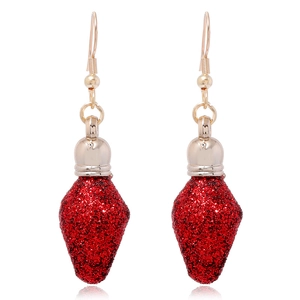 Close-up of red Christmas bulb earrings with sparkling glitter and golden hooks