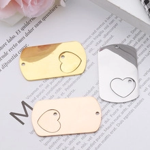 Polished metal dog tag charms in gold silver and rose gold with heart cutouts for DIY jewelry