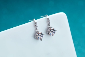 Macro detail of S925 sterling silver drop earring with 1ct round moissanite stone