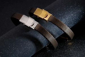 Close-up of brown textured bracelets with gold and silver stainless steel buckles