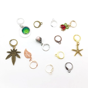 DIY lever back earring hooks with star, leaf and bell pendants in various metal colors