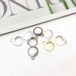 Detailed view of various metal French earring hooks in gold, silver and bronze finishes