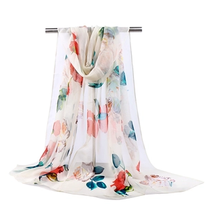 Detailed texture of georgette summer scarf featuring colorful floral print on cream base