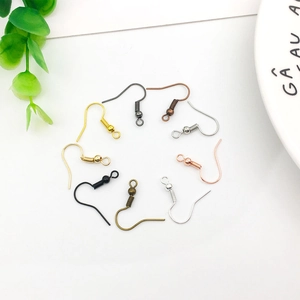 DIY jewelry earring hooks in multiple metallic finishes shown with decorative greenery