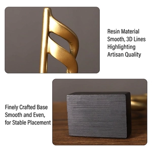 Minimalist golden resin musical note sculpture with black base for desk decor