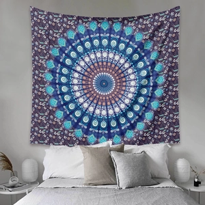Detail of blue and purple mandala tapestry hanging as a bohemian bedroom wall backdrop