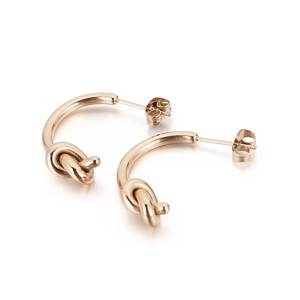 Boucles d'oreilles clous minimalistes en acier titane doré avec design nœud poli