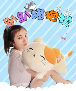 Soft long cat plush pillow with orange spots held by a model for size display