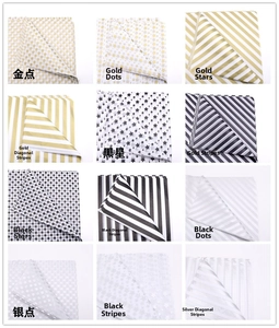 Detailed grid of tissue paper with gold and silver foil stars, dots, and stripes patterns