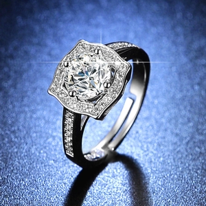 Close-up of a silver adjustable ring featuring a six-prong set solitaire round diamond