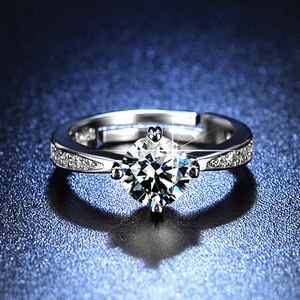 Macro shot of a six-prong adjustable silver ring with a brilliant round-cut diamond simulant