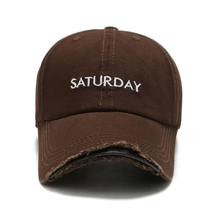 Distressed dark brown baseball cap with Saturday embroidery and vintage frayed brim style