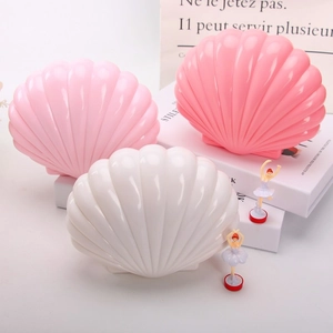 Detailed view of heart-shaped shell jewelry music boxes in pink and white colors