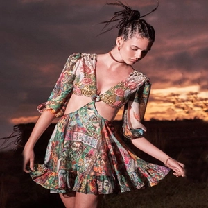 Bohemian landscape print mini dress with waist cut-outs and V-neck in outdoor sunset