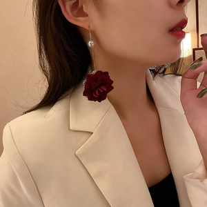 Elegant long red rose drop earrings with pearls shown on a model in vintage style