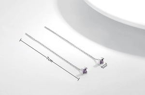 Detail view of S925 silver threader earrings with 5mm purple square cubic zirconia and 7cm length