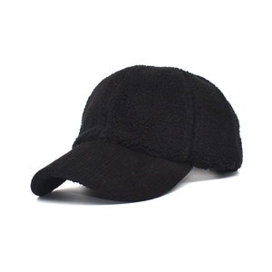 Detail of black baseball cap with fleece texture and corduroy brim for winter warmth