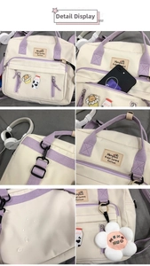 Detail view of canvas messenger bag showing daisy charm and waterproof fabric pockets